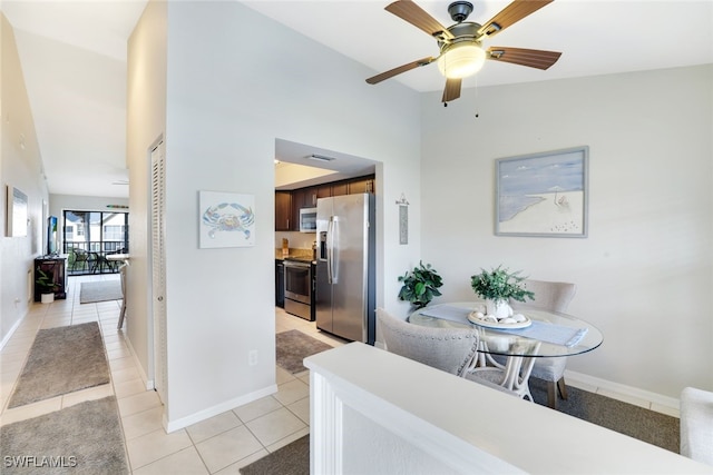 dining room featuring ceiling fan and light tile patterned floors