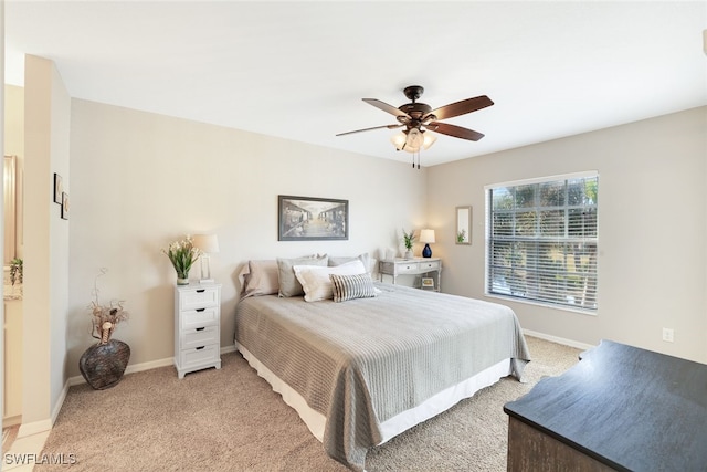 bedroom featuring ceiling fan and light colored carpet