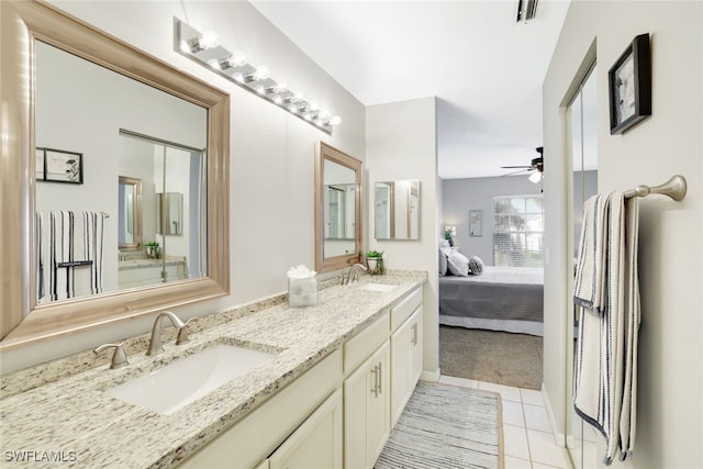 bathroom with tile patterned floors, ceiling fan, and vanity