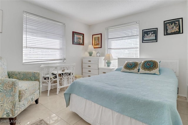 bedroom featuring light tile patterned flooring