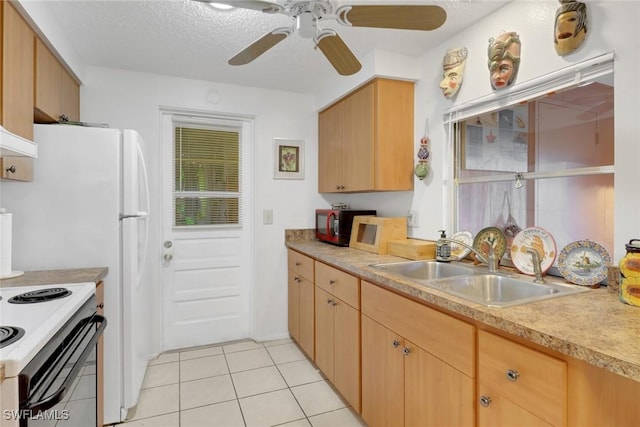 kitchen with range with electric stovetop, light countertops, light tile patterned flooring, a sink, and a textured ceiling