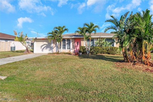 ranch-style home with central AC, driveway, a front lawn, and fence