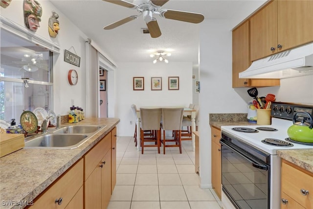 kitchen featuring light tile patterned floors, under cabinet range hood, electric range, a sink, and light countertops