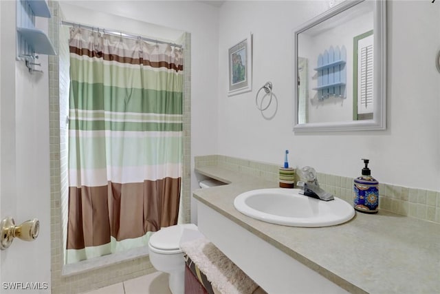 full bathroom with toilet, a shower with curtain, tile patterned floors, and vanity