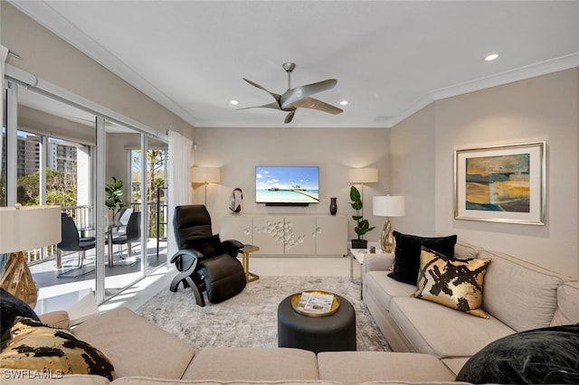 living room featuring ceiling fan and ornamental molding