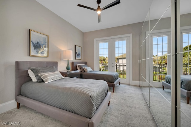 carpeted bedroom featuring french doors, access to outside, and ceiling fan