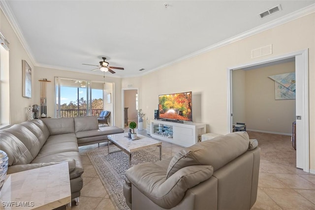 tiled living room featuring ceiling fan and ornamental molding