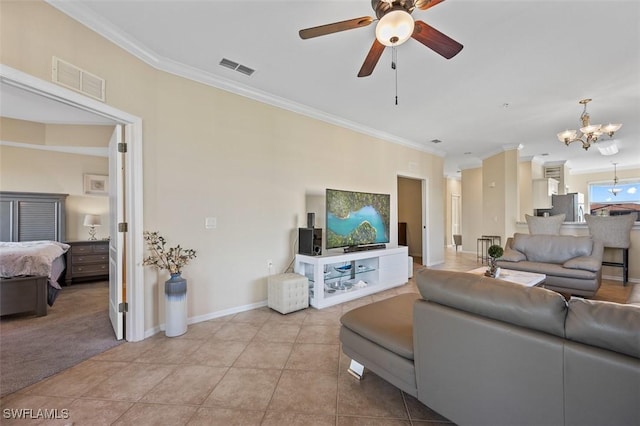 living room with light tile patterned floors, ceiling fan with notable chandelier, and ornamental molding