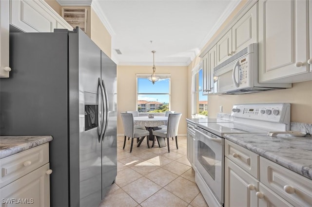 kitchen featuring white cabinetry, hanging light fixtures, white appliances, light tile patterned flooring, and ornamental molding