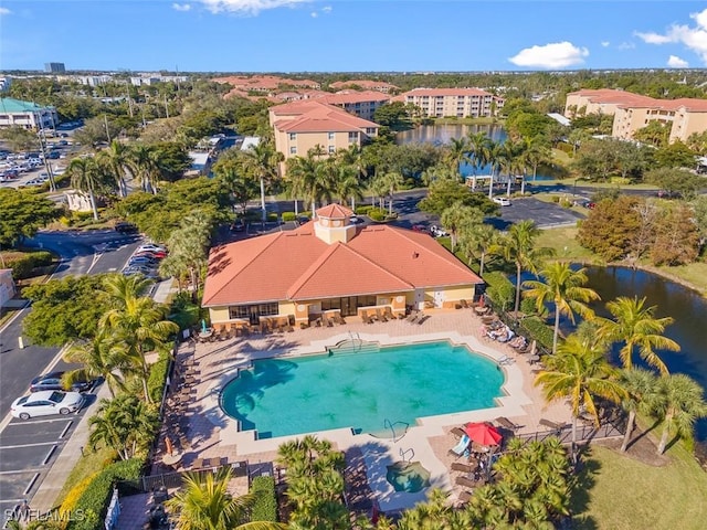 birds eye view of property featuring a water view