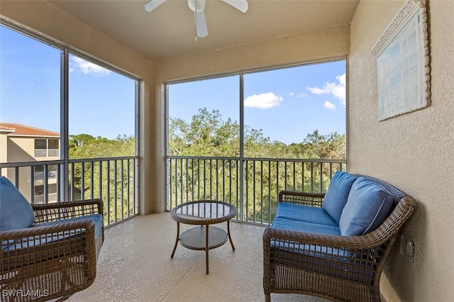 sunroom / solarium with ceiling fan