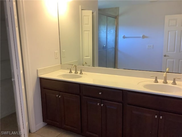 bathroom featuring tile patterned floors and vanity