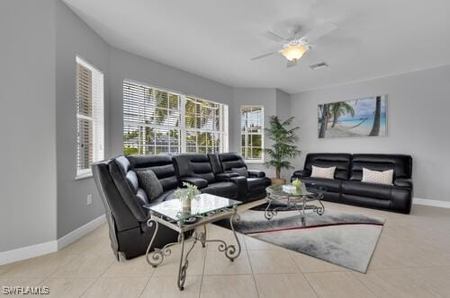 tiled living room with ceiling fan