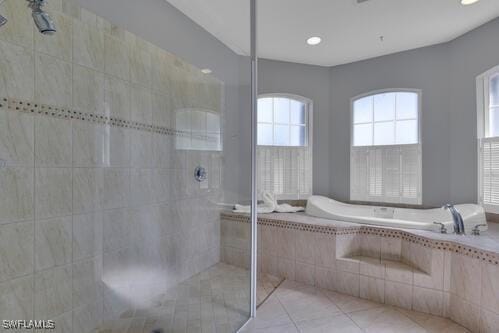 bathroom with separate shower and tub and tile patterned floors