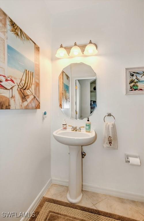 bathroom featuring tile patterned flooring and baseboards