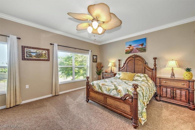 carpeted bedroom with a ceiling fan, crown molding, and baseboards