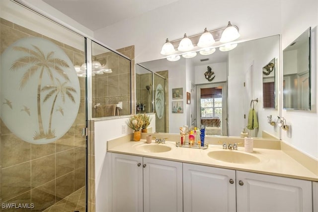 bathroom featuring double vanity, a shower stall, and a sink