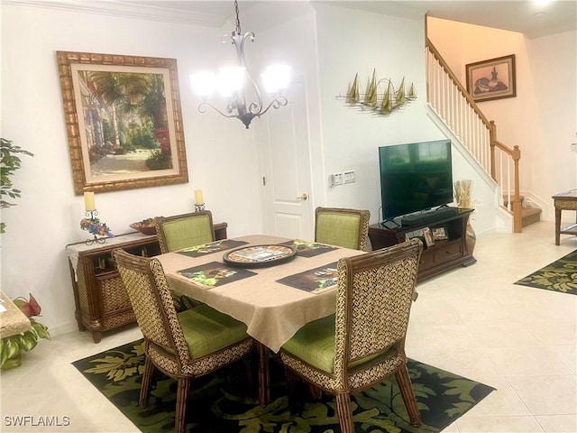 tiled dining space with stairs, a notable chandelier, baseboards, and ornamental molding
