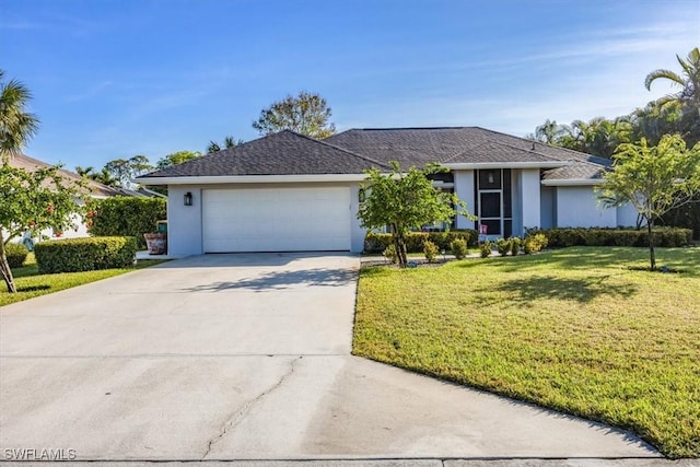 single story home with a front yard and a garage