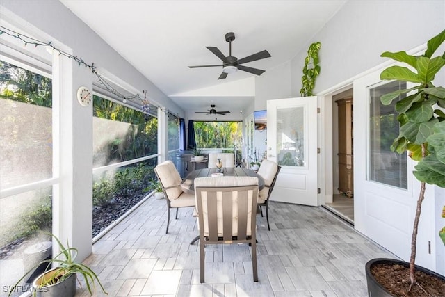 sunroom / solarium with vaulted ceiling