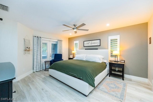 bedroom featuring french doors, hardwood / wood-style flooring, and ceiling fan