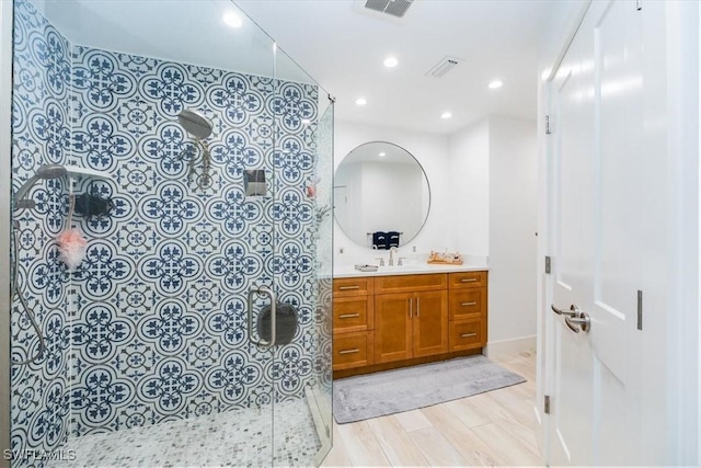 bathroom with vanity and wood-type flooring