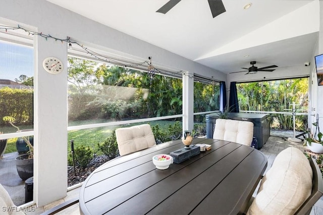 sunroom featuring ceiling fan and lofted ceiling