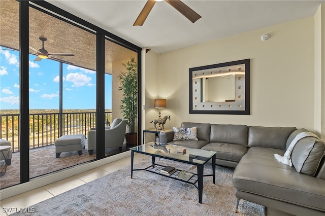 tiled living room featuring a wall of windows