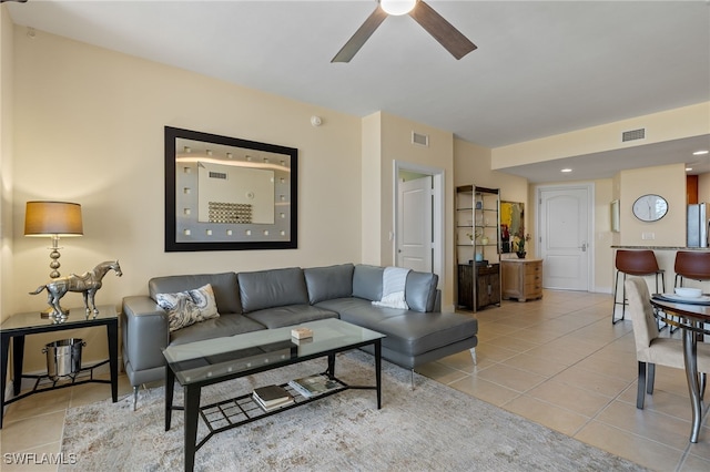 living room with ceiling fan and light tile patterned flooring