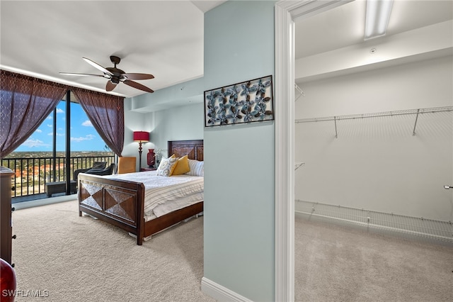 carpeted bedroom featuring access to exterior and ceiling fan