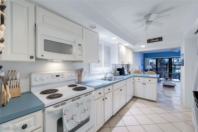 kitchen featuring kitchen peninsula, light tile patterned floors, white cabinets, and white appliances