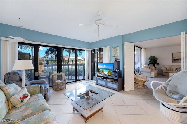 tiled living room with ceiling fan