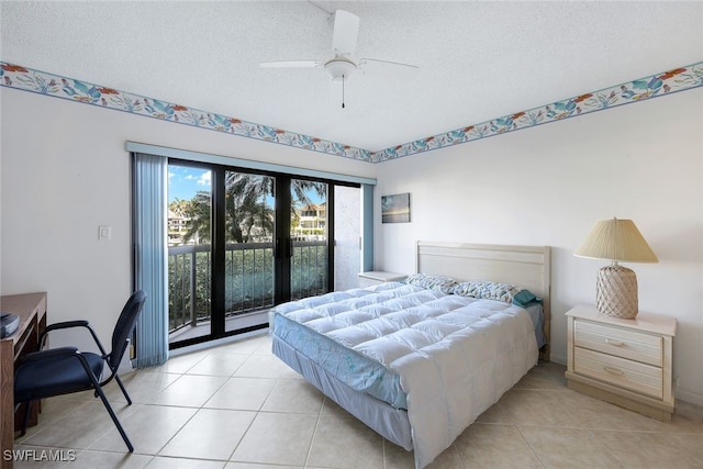 tiled bedroom with a textured ceiling, access to outside, and ceiling fan