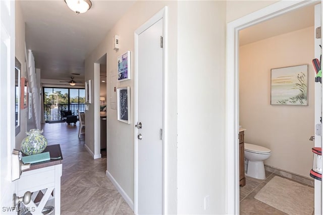 hallway featuring light tile patterned floors