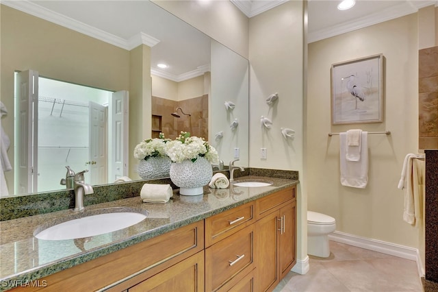 full bath featuring a tile shower, tile patterned floors, crown molding, and a sink