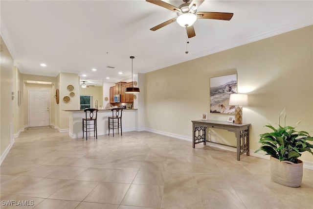 living room with crown molding, baseboards, recessed lighting, light tile patterned flooring, and a ceiling fan