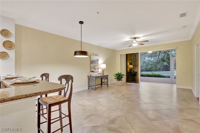 965 Tarpon Cove Dr Unit 103, Naples, FL 34110 - dining room featuring ceiling fan, ornamental molding, and light tile patterned floors