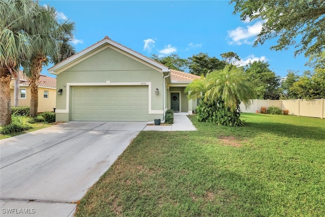 view of front of house with a garage and a front yard