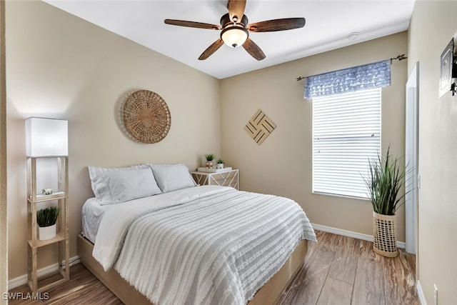 bedroom featuring ceiling fan and wood-type flooring