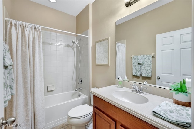 full bathroom with vanity, shower / bath combo, and toilet