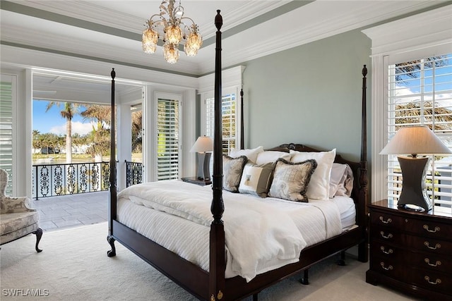 bedroom featuring access to outside, carpet flooring, crown molding, and an inviting chandelier