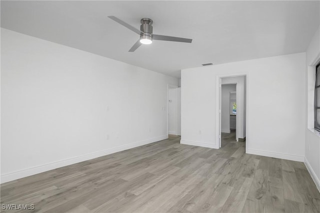 unfurnished room featuring ceiling fan and light wood-type flooring