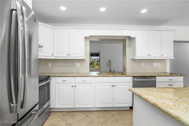 kitchen with sink, white cabinets, and stainless steel appliances