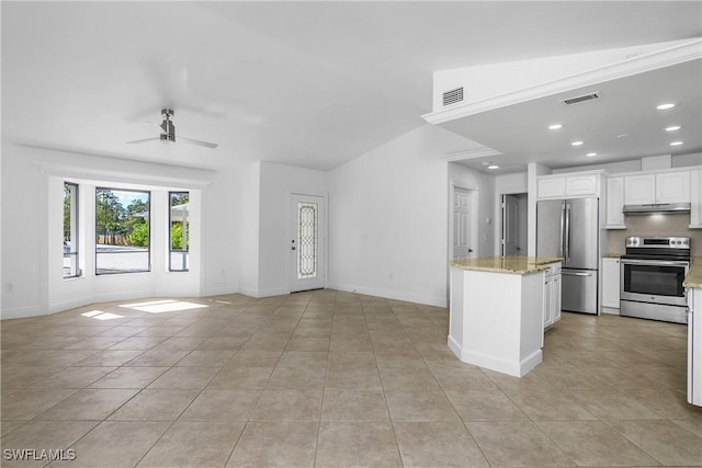 interior space with ceiling fan and light tile patterned flooring