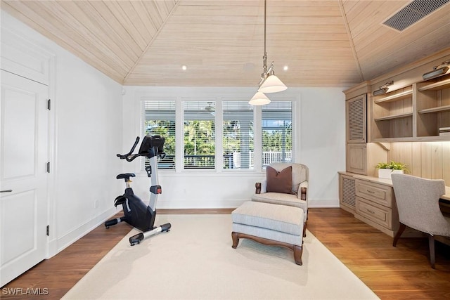 exercise room with hardwood / wood-style floors, wooden ceiling, and lofted ceiling