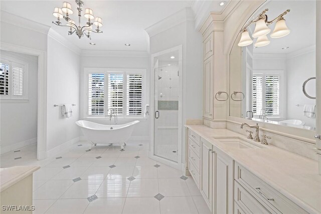 bathroom with a notable chandelier, vanity, ornamental molding, and a wealth of natural light