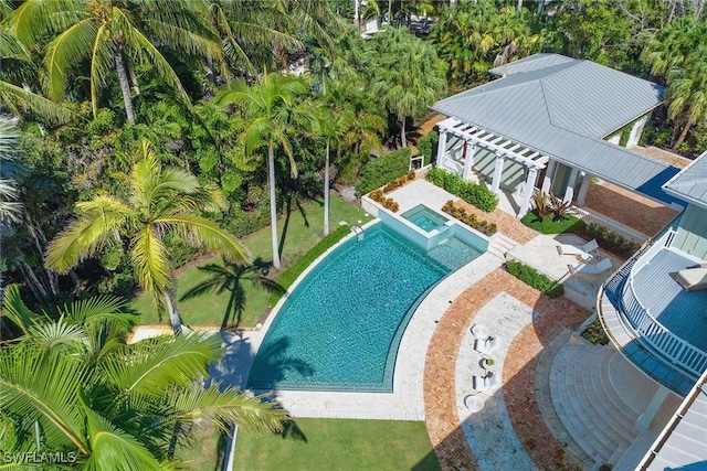 view of swimming pool with a patio area and an in ground hot tub