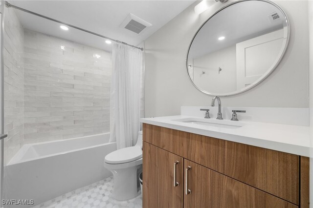 full bathroom with vanity, shower / bath combination with curtain, and toilet