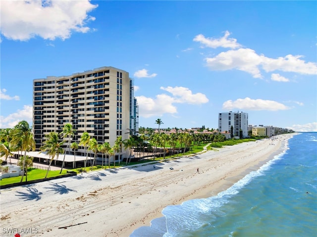 exterior space with a beach view and a water view