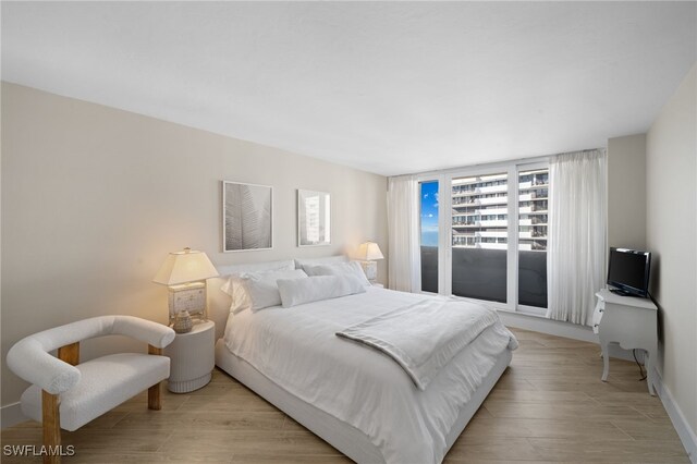 bedroom with light hardwood / wood-style flooring